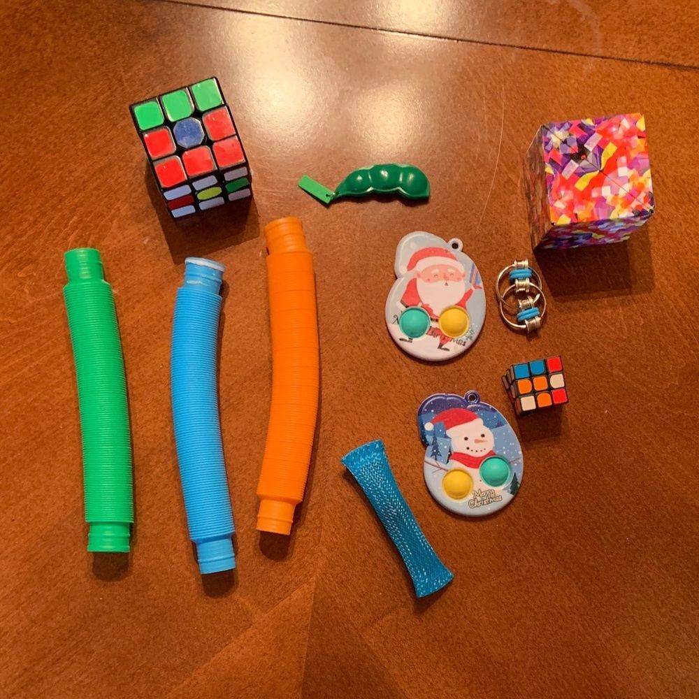 Colorful Kids Fidget Set with Puzzle Cubes, pop its, and more.